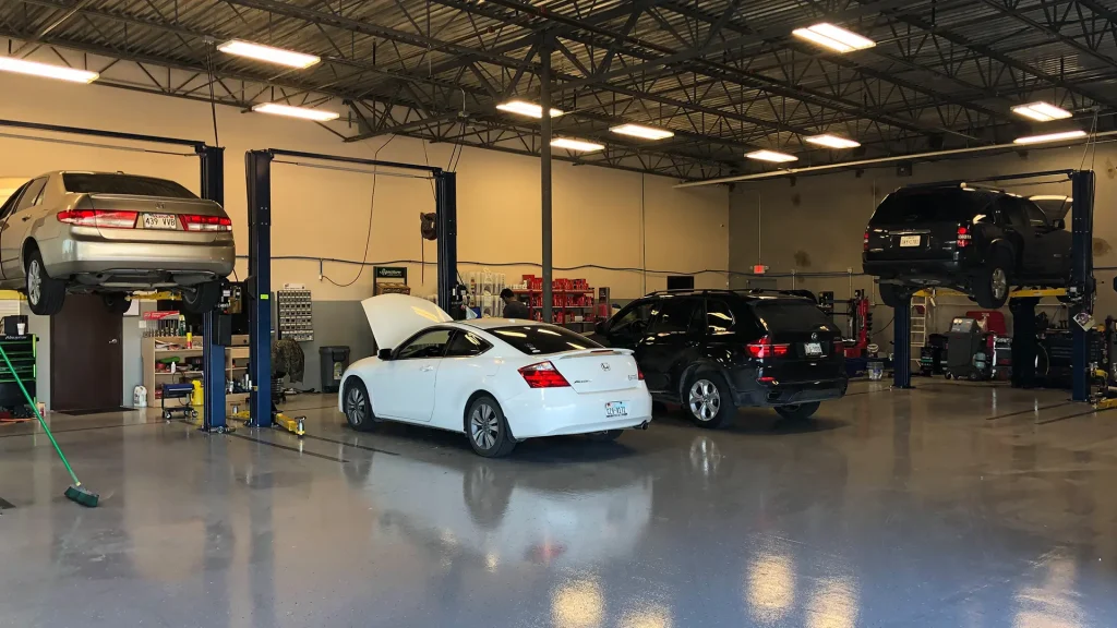 Service bays at Integrity 1st Car Pros Wylie, vehicles up on the lifts