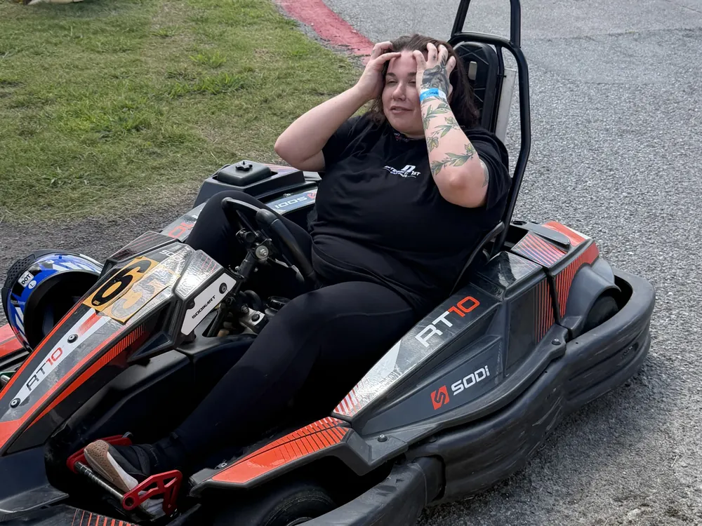 An Integrity 1st team member in a go-kart at the team race event