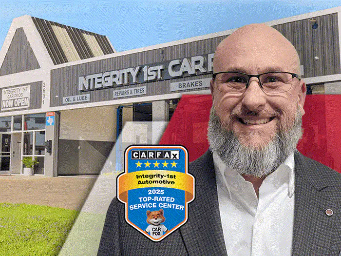 The manager of the Carrollton and Addison Integrity 1st Car Pros shop, outside the building