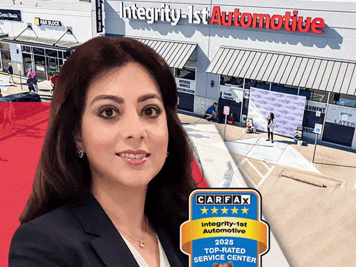 The manager of the Wylie Integrity 1st Car Pros shop, outside the building