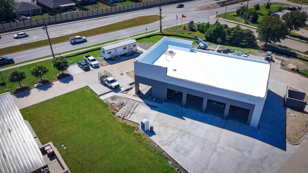 The service bay openings at the Anna shop, with the concrete apron poured in front of them