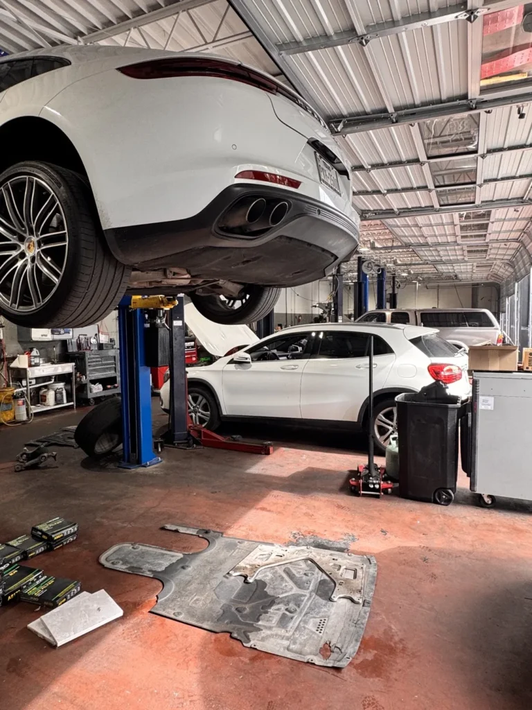 Vehicles up on the lifts in the service bays at the Belmont Avenue shop