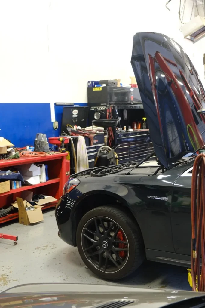 A vehicle with its hood up on the shop floor at the Davenport Road shop