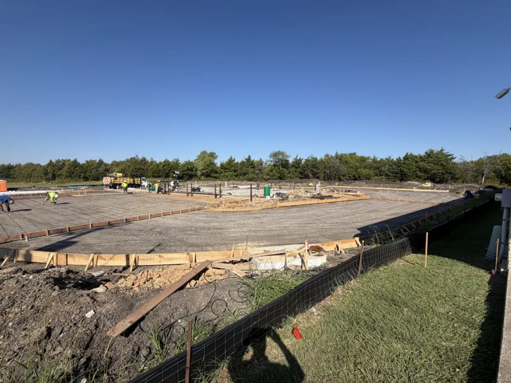 Timber forms laid out across the new Wylie site in October 2026, marking the shape of the building