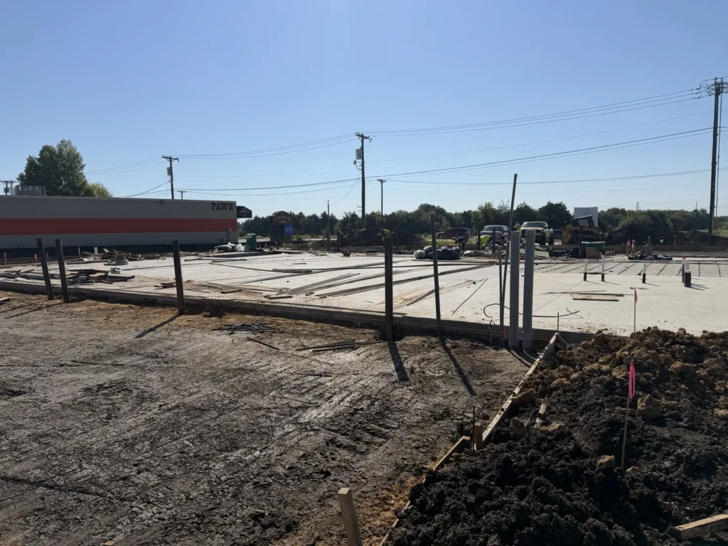 Wide view of the formed and partly poured slab at the new Wylie site in October 2026