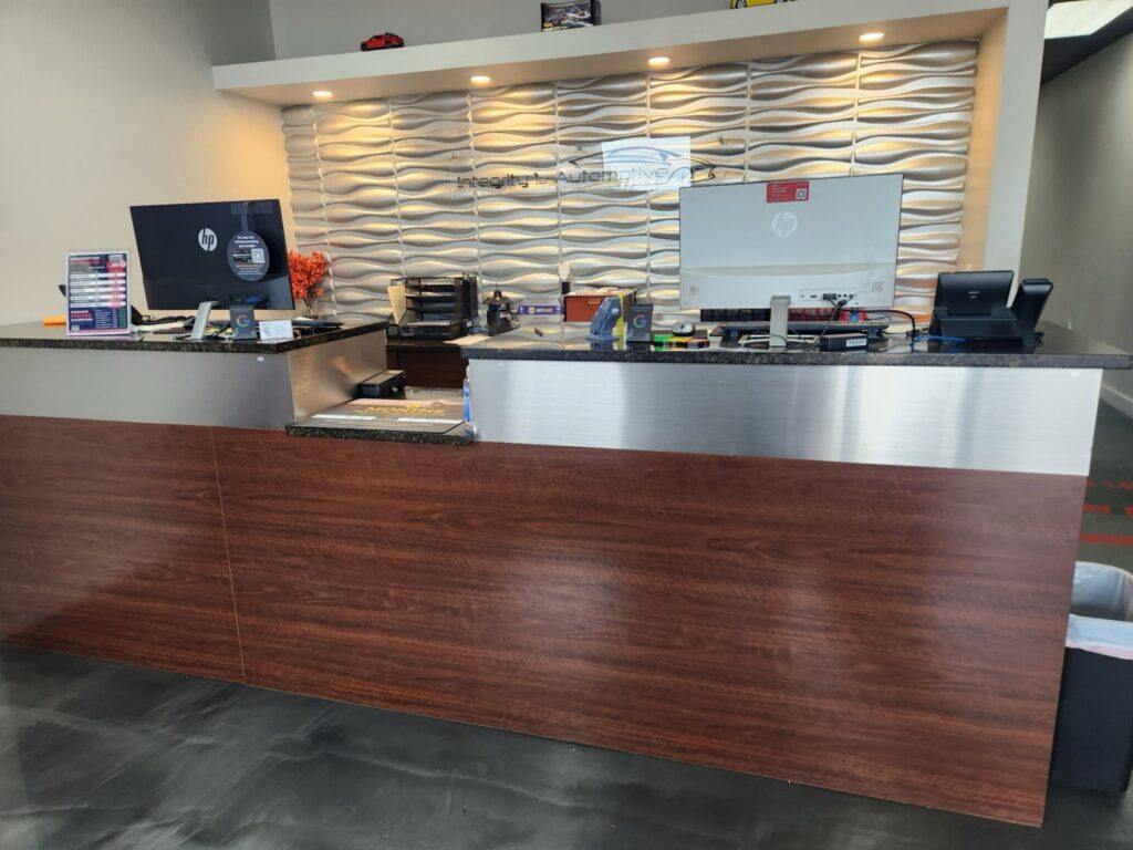 The reception counter at the Wylie shop, below the branded wave wall